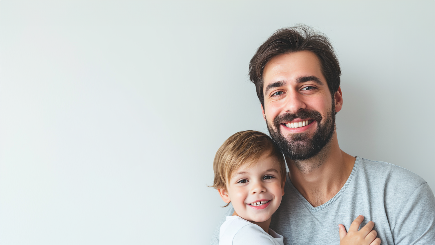 Father and son embracing warmly, representing a family reunited through immigration